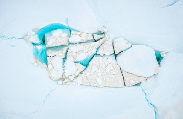 icebergs melting in a blue lagoon top view of icebergs melting in a blue lagoon in the arctic. Greenland ilulissat photos stock pictures, royalty-free photos & images