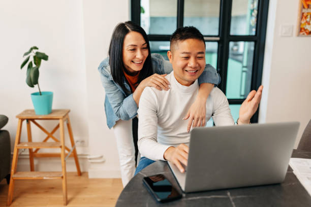 istock A young couple uses a laptop to talk on a video call 1457344916