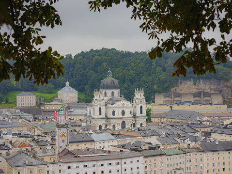 Salzburg Austria inner city with churches. Beautiful view of Salzburg skyline with Festung Hohensalzburg in cloudy summer, Salzburg, Salzburger Land, Austria