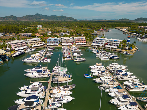 General landscape view of Harbor and marina with moored boats and luxury yachts in Key Biscayne Pier at Miami, Florida, United States of America USA in a sunny summer day.