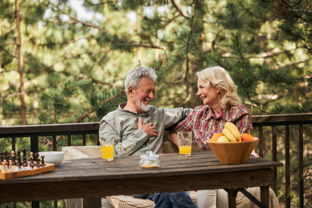 istock Cheerful senior couple talking on a terrace. 1457353741