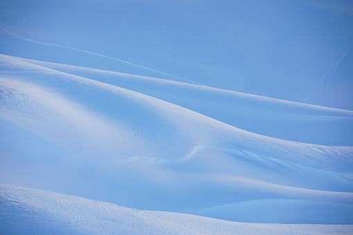 Abstract Powder snow texture. Perfect  off piste ski slope.  High mountain  landscape  At the top. Italian Alps  ski area. Ski resort  Italy, Europe.
