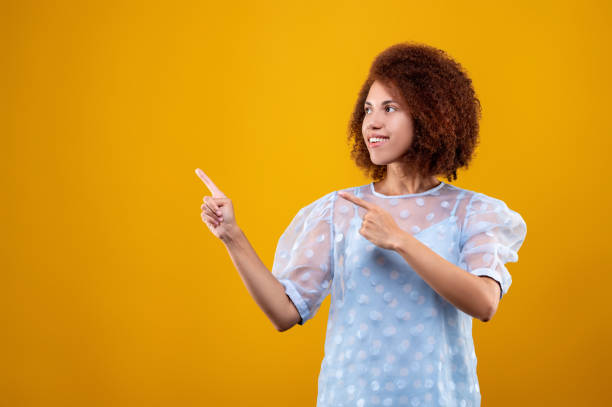 istock A woman in white blouse gesticulating and looking contented 1457357431