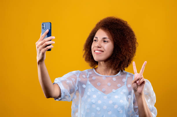 istock Young woman looking contened and making selfie 1457357481
