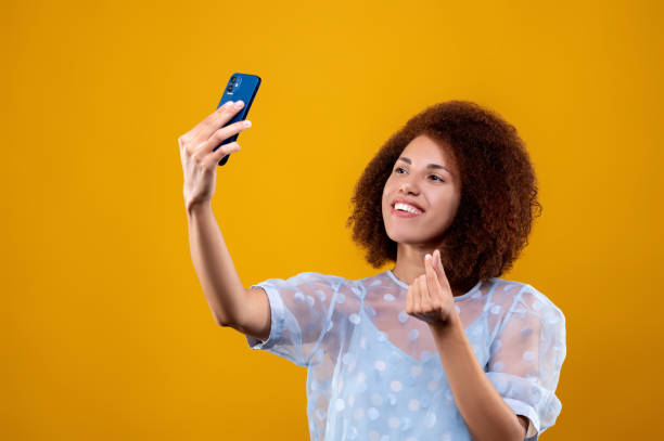 istock Young woman looking contened and making selfie 1457357517