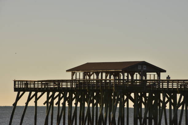 istock Large Wooden Pier Against Sunrise 1457359530