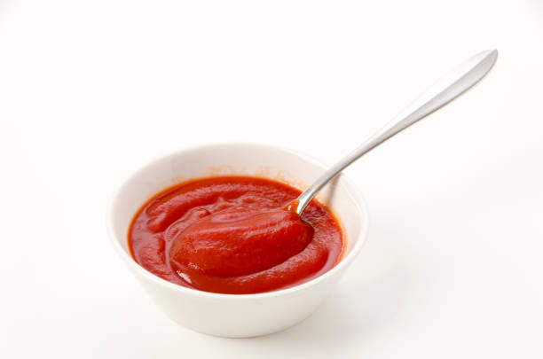 istock Tomato Ketchup in a white bowl on a white background 1457361767