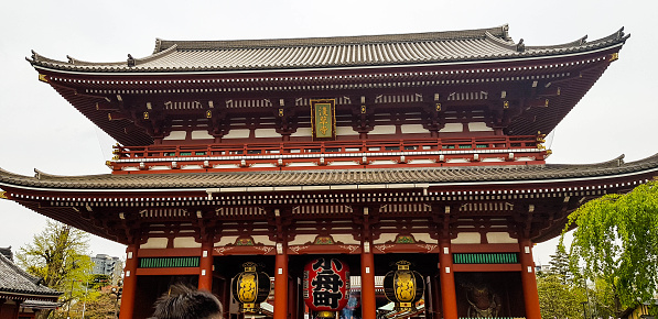 Tokyo, Japan in July 2019. Visitors on vacation to senso ji temple. Senso-ji is an ancient Buddhist temple located in Asakusa, Tokyo, Japan. A very popular location among international tourists.