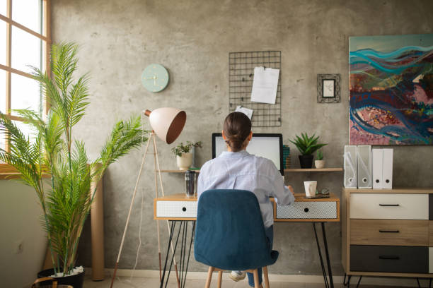 istock Mid adult woman working from home on a desktop computer 1457363802