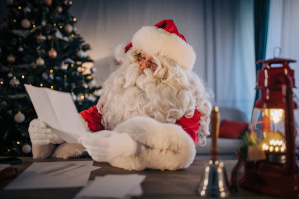 istock Santa Claus reading a letter 1457363921