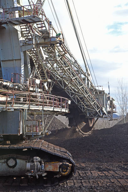 istock Bucket-wheel excavator during excavation at the surface mine. Huge excavator on open pit mine. 1457366091