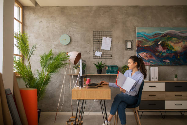 istock Woman working on a desktop PC at home 1457366124