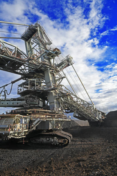 istock Bucket-wheel excavator during excavation at the surface mine. Huge excavator on open pit mine. 1457366420
