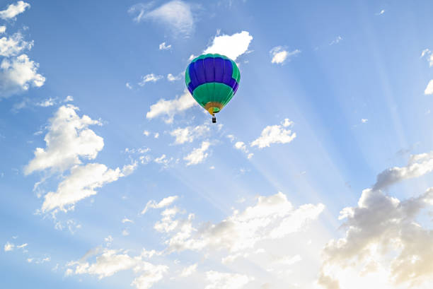 Colorful hot air balloon flying over blue sky