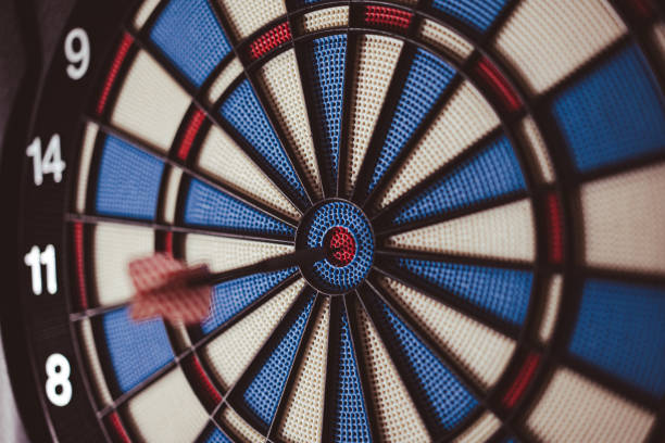 istock Dart hitting the center bull's eye 1457369187