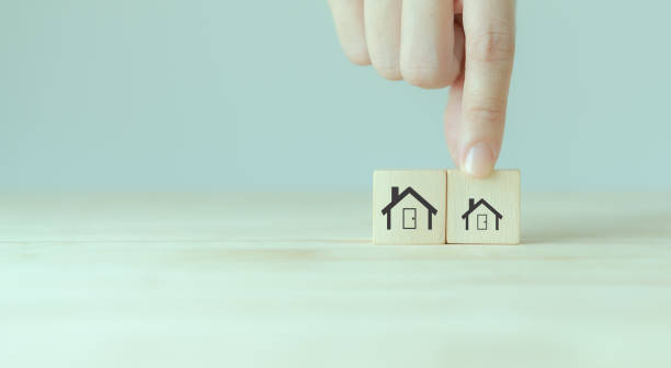 istock Downsizing home, houses concept. Downsizing property due to retirement or budget. Finding a tiny house or apartment. Moving to a smaller property for retirement time.  Increasing cash flow. 1457370009
