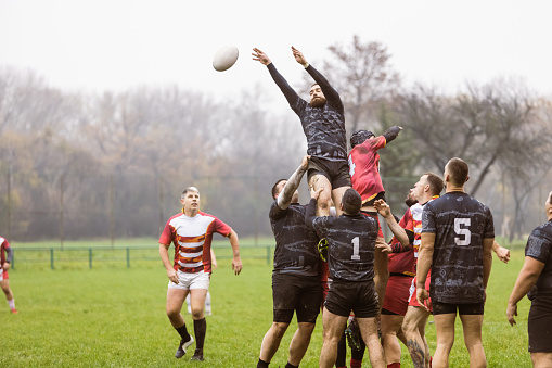 Players performing rugby lineout (touch)