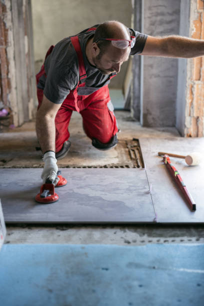 istock Laying floor tiles 1457370482