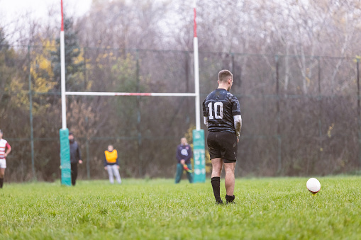 Rugby player performing penalty kick