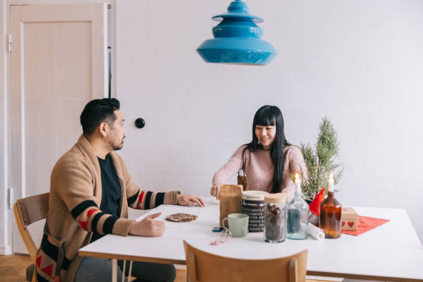 istock Couple making gingerbread cookies at home 1457371352