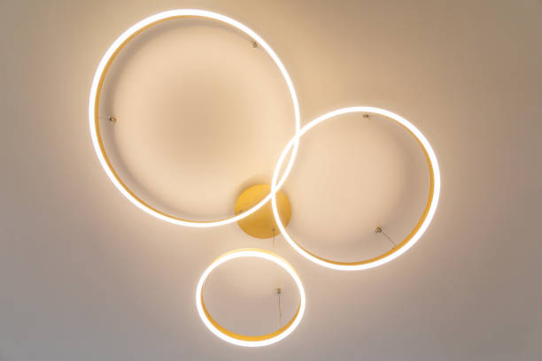 istock Closeup of creative round chandelier with lights on 1457374862