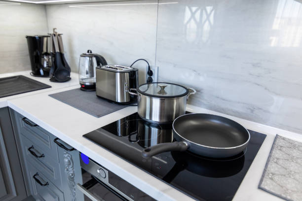 istock Kitchen appliances and utensils on table 1457374996