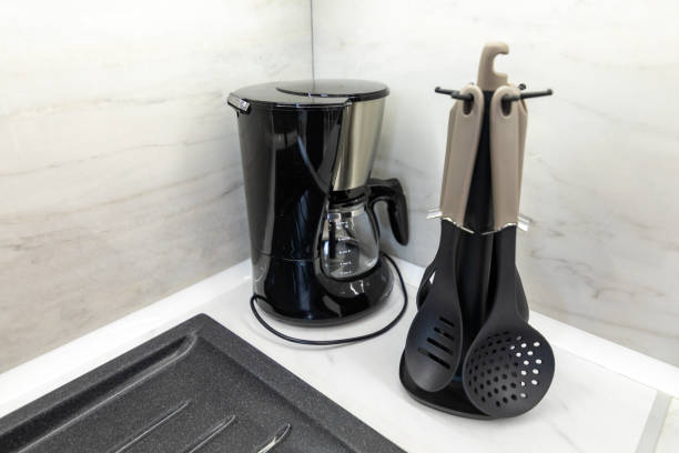 istock Closeup of coffee machine and kitchen appliances on table 1457375249