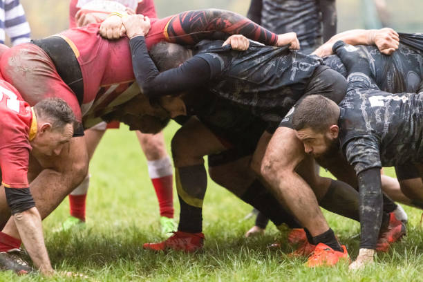 Rugby teams performing scrum stock photo