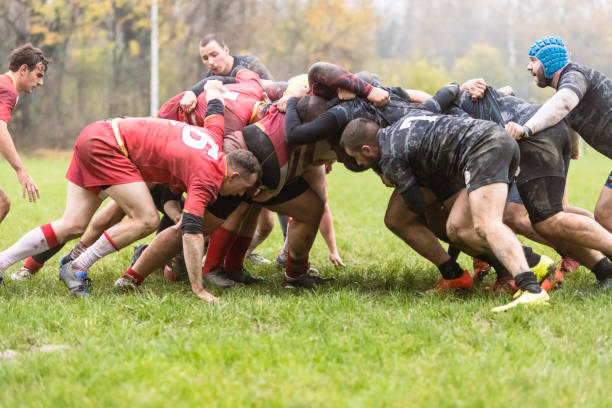 Rugby teams performing scrum stock photo