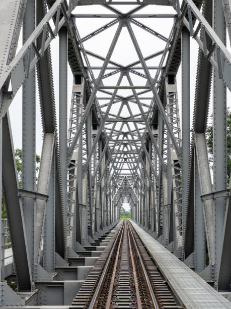 istock Perspective view of the steel railway bridge. 1457376168