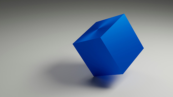 blue cube in modern design with metal surface on grey background standing on the edge