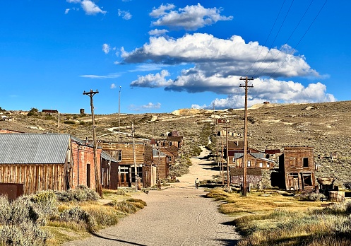 Bodie is a ghost town in the Bodie Hills east of the Sierra Nevada, it became a boom town in 1876 (146 years ago) after the discovery of a profitable line of gold; by 1879 it had a population of 7,000–10,000.