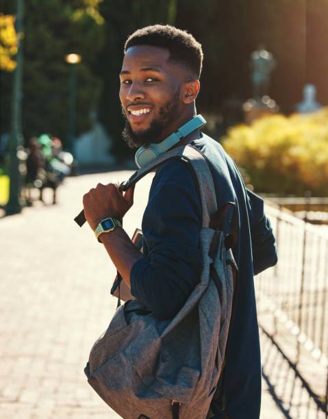 istock Black man, student on campus  for university in outdoor portrait, education and study with backpack. College, smile and higher education with learning for development and scholarship, going to class. 1457378917