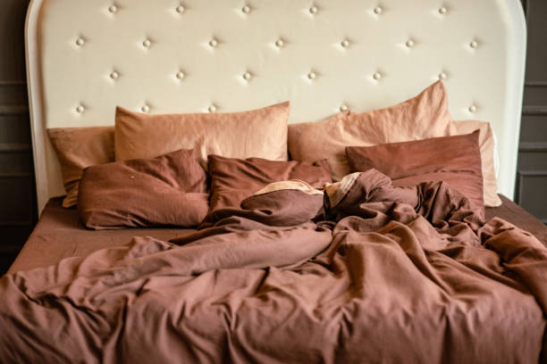 istock White bed and brown pastel bed on it 1457380988