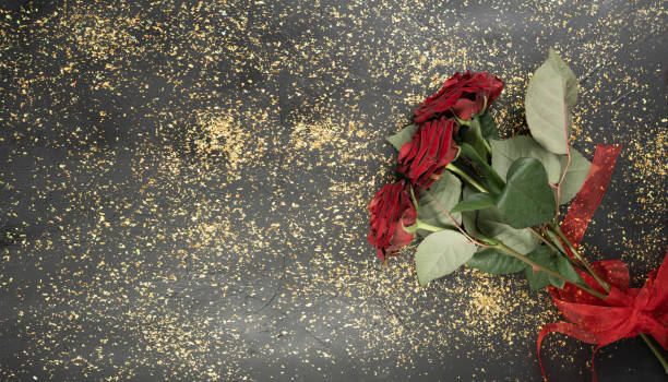 Free Stock Photo of Red roses spread against a dark background ...