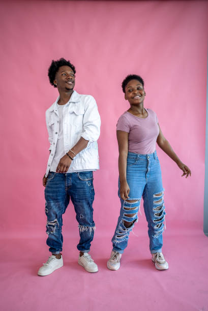 Young friends on a pink background