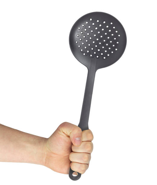 istock outstretched hand with colander, cooking concept 1457385939