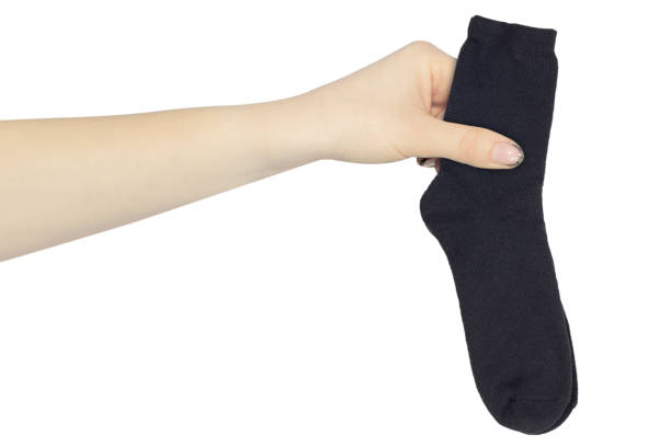 istock hand with outstretched socks isolated, give socks, give warm socks 1457386041