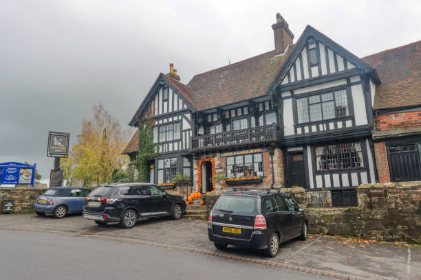 Cars parked outside the Star & Eagle Hotel on Goudhurst High Street in Kent, England