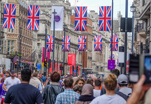 London, UK. 10th May 2022. Union Jack flags on Oxford Street for the Queen's Platinum Jubilee, marking the 70th anniversary of the Queen's accession to the throne.