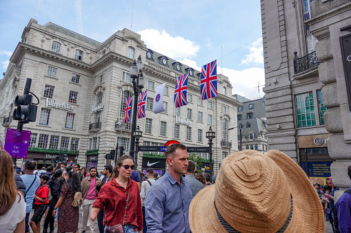People celebrating the Platinum Jubilee near Lillywhites Department Store at Piccadilly Circus in City of Westminster, London