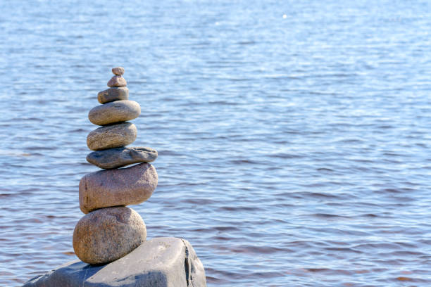 istock Pyramid of stones. Unstable balance of stone objects. 1457391149