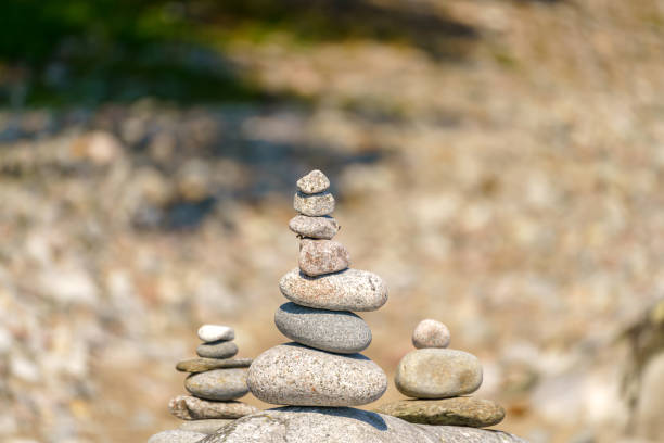 istock Pyramid of stones. Unstable balance of stone objects. 1457391721