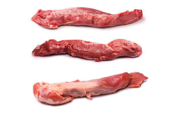 istock Raw pork tenderloin isolated on a white background. 1457393508