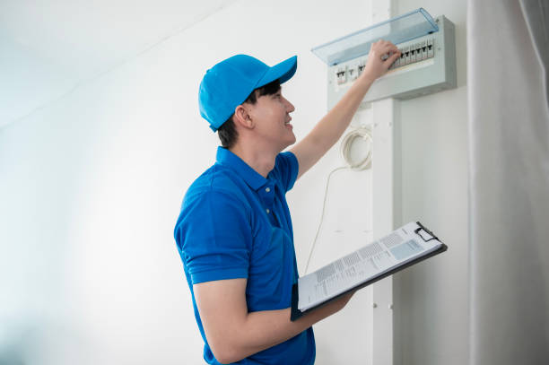 istock An Asian young Technician service man wearing blue uniform checking electrical appliances in home 1457395572