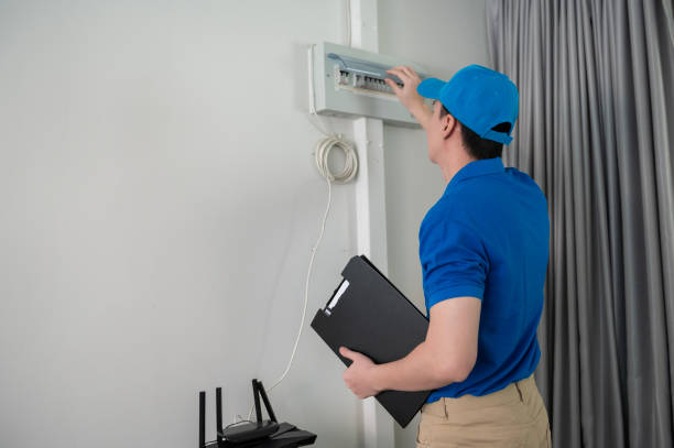 istock An Asian young Technician service man wearing blue uniform checking electrical appliances in home 1457395580