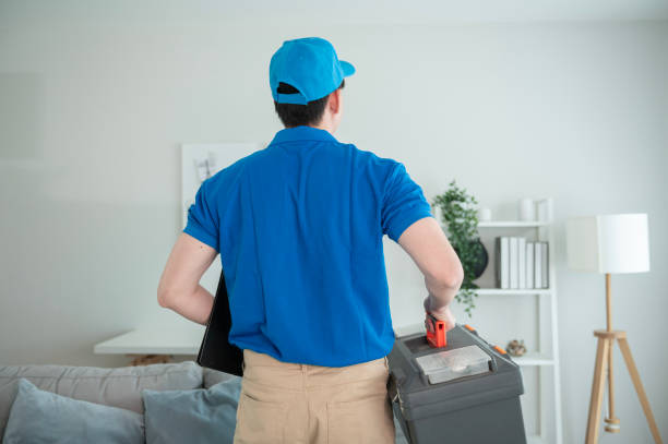 istock An Asian young Technician service man wearing blue uniform checking electrical appliances in home 1457395625