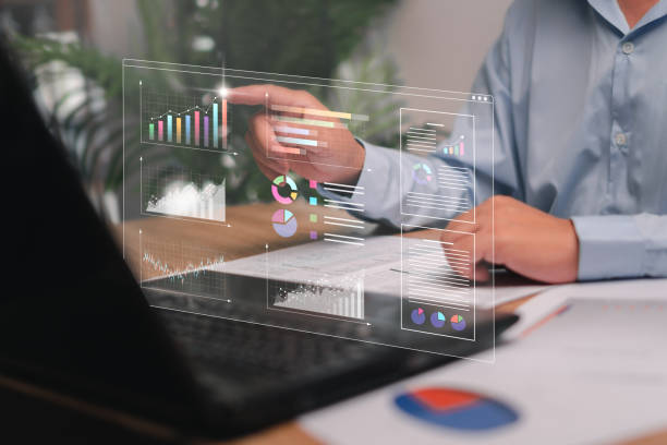 istock Businessman point to Graph on smart digital marketing analysis and data management use laptops working, Business strategy concept, Graph marketing data Digital show on virtual screen, data management 1457397181