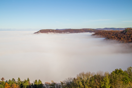 Above the clouds. View of the fog in the valley
