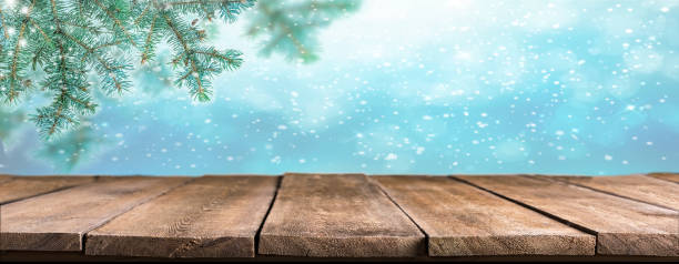 istock Christmas empty wooden table and pine branches 1457404112